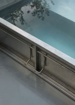 Photograph of The Missing Room pavilion by Carroccera Collective, an open-air living space immersed in the forest, Piedmont, Italy.