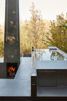 Photograph of The Missing Room pavilion by Carroccera Collective, an open-air living space immersed in the forest, Piedmont, Italy.