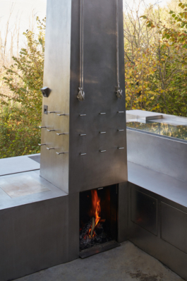 Photograph of The Missing Room pavilion by Carroccera Collective, an open-air living space immersed in the forest, Piedmont, Italy.