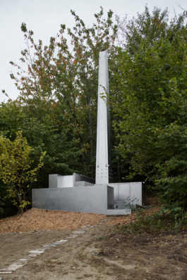 Photograph of The Missing Room pavilion by Carroccera Collective, an open-air living space immersed in the forest, Piedmont, Italy.