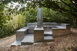 Photograph of The Missing Room pavilion by Carroccera Collective, an open-air living space immersed in the forest, Piedmont, Italy.