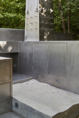 Photograph of The Missing Room pavilion by Carroccera Collective, an open-air living space immersed in the forest, Piedmont, Italy.