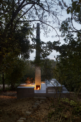 Photograph of The Missing Room pavilion by Carroccera Collective, an open-air living space immersed in the forest, Piedmont, Italy.